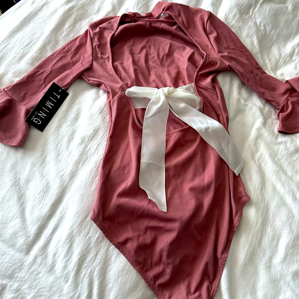 Body suit with back bow .